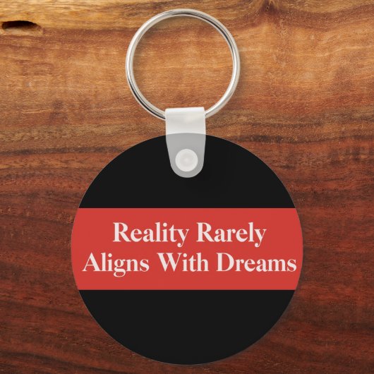 Die Realität passt sich selten den Träumen an Schlüsselanhänger (Vorderseite)