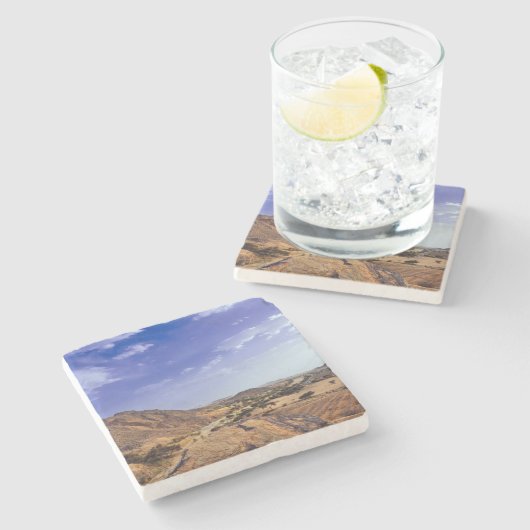 Die reizvolle Schönheit der Wüste unter einem blau Steinuntersetzer (Seitenansicht)