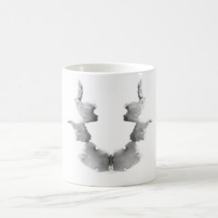Die Rorschach Test-Tinte befleckt Kopf-Gesichter Kaffeetasse