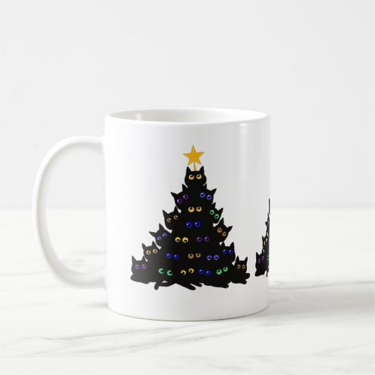 Die schwarze Katze hat sich in den Weihnachtsbauml Kaffeetasse (Links)