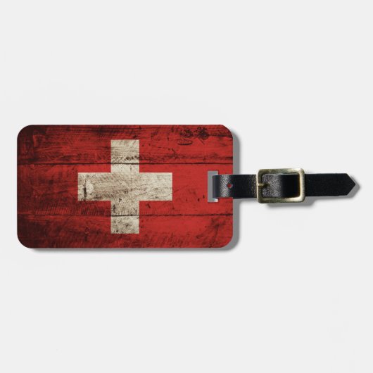 Die Schweiz-Flagge auf altem hölzernem Korn Gepäckanhänger (Vorderseite horizontal)