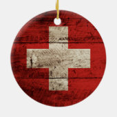 Die Schweiz-Flagge auf altem hölzernem Korn Keramikornament (Hinten)