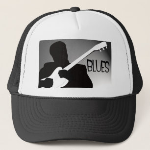 Die Silhouette des Bluesspielers mit einem Truckerkappe