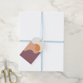 Die Sonne geht hinter den lila Hügeln herunter Geschenkanhänger (Mit Garn)