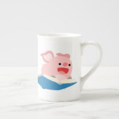 Die Tasse "Flying Book and Cartoon Pig-Bone-China" (Rechts)