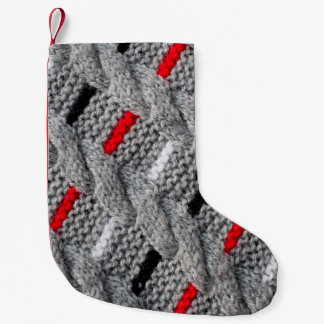 die Textur des Strickstoffes mit gestreiftem p Kleiner Weihnachtsstrumpf