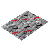 die Textur des Strickstoffes mit gestreiftem p Notizblock (Linke Seite)
