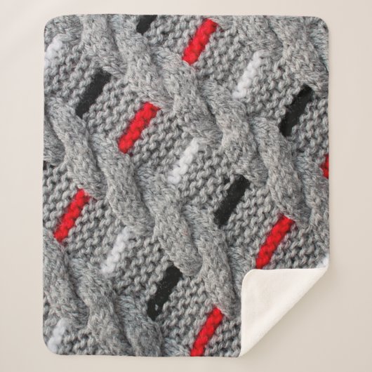 die Textur des Strickstoffes mit gestreiftem p Sherpadecke (Vorderseite)