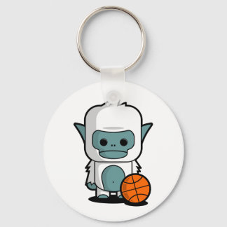 Die Tiny Yeti, die Korbball spielen Schlüsselanhänger