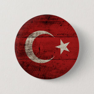 Die Türkei-Flagge auf altem hölzernem Korn Button