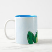 Die Verfolgung Zweifarbige Tasse (Links)