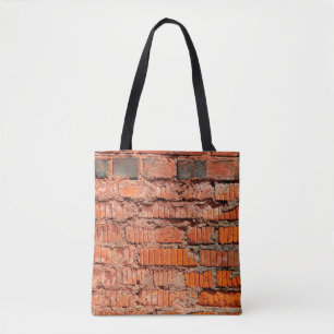 Die Wand aus rotem Ziegelstein ist veraltet, alt,  Tasche