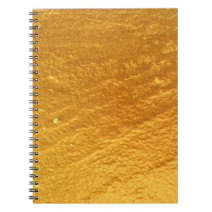 Die Wandstruktur aus goldfarbenem Beton ist abstra Notizblock