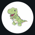 Dinosaur Christmas Snow Winter T-Rex Dino Runder Aufkleber<br><div class="desc">The T-Rex for Christmas with fairy lights. Funny animals with gifts and snow for the holidays. Also funny for Christmas in July. Dinos are cute animals and perfect for Christmas.</div>