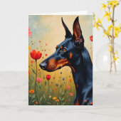 Doberman auf einem Gebiet der Blume Karte (Gelbe Blume)