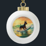 Doberman Beach Surfing Painting Keramik Kugel-Ornament<br><div class="desc">Tauchen Sie ein in die spielerische Welt des Kaninchen-Abenteuers mit diesem faszinierenden Bild. Ein gepflegter Hund geht zu den Wellen und reitet geschickt auf einem sonnengeküssten Strand. Das lebendige Kunstwerk vereint wunderbar das Wesentliche der Erregung am Strand, während der Hund furchtlos auf den Wellen reitet und den Geist von Spaß...</div>