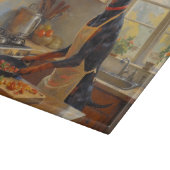 Doberman Cooking in Kitchen Schneidebrett (Ecke)