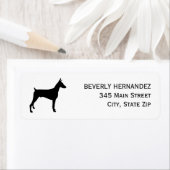 Doberman Dog Walker Trainer Welpe sitzend (Insitu)