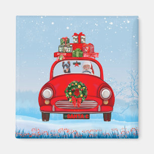 Doberman Hund in Auto mit dem Weihnachtsmann Magnet