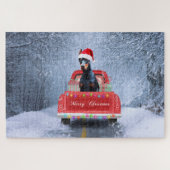 Doberman Hund in Schnee sitzen im Weihnachtswagen Puzzle (Horizontal)