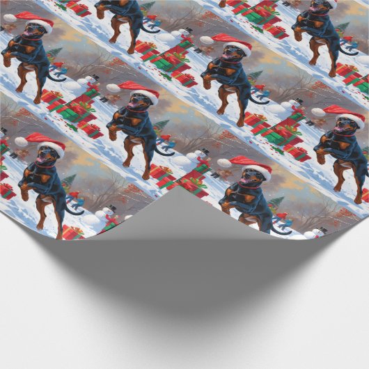 Doberman läuft im Schnee mit Weihnachtshut Geschenkpapier (Ecke)
