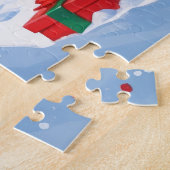 Doberman läuft im Schnee mit Weihnachtshut Puzzle (Seite)