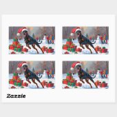 Doberman läuft im Schnee mit Weihnachtshut Rechteckiger Aufkleber (Blatt)