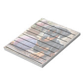 Doberman Puppy mit Garnball auf einem farbenfrohen Notizblock (Rotiert)