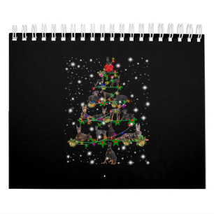 Doberman Weihnachtsbaum bedeckt durch Blitzlicht Kalender
