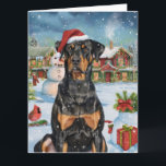 Doberman Winter Wonderland Christmas Joy Karte<br><div class="desc">Dieses festliche Design spiegelt den fröhlichen Geist der Urlaubssaison wider und besticht durch ein hübsches Jungtier mit einer Weihnachtsmannmütze. Der Hund ist eingebettet in ein winterliches Wunderland, mit einem Schneemann, einem dekorierten Weihnachtsbaum und wunderschön verpackten Geschenken. Schneeflocken fallen sanft ab und geben der Szene eine magische Touch, während die lebhaften...</div>