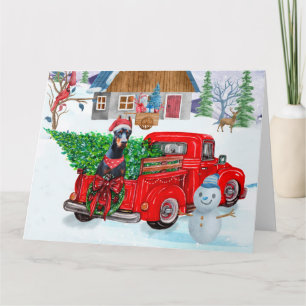Dobermann-Hund im Weihnachtslieferwagen Schnee Karte