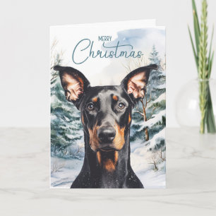 Dobermann-Hund Schnee Winter Kiefern Weihnachten