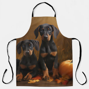 Dobermann-Welpe Herbstfreude Kürbis Schürze