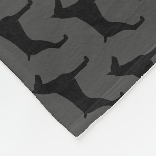 Dobermannpinscher-Silhouette-Muster-Grau Fleecedecke (Ecke)
