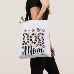 Dog Mom Leopard Print Tote Bag Tasche<br><div class="desc">This fierce and adorable Dog Mom tote bag is made for every proud dog mama! Bold leopard print “DOG” with elegant cursive “Mom” sits perfectly with cute paw prints, hearts, sparkles and bones. It’s the perfect everyday bag for groceries, books, dog park walks or just showing off your dog love....</div>