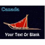 Dog Sled - Kanada Fotoskulptur Magnet<br><div class="desc">Dog sled with a red sled bag superimsed wir starry background. Text Reading,  "Canada" Appears in glowing blue. You may add your own additional text both on the sled bag and at the bottom.</div>