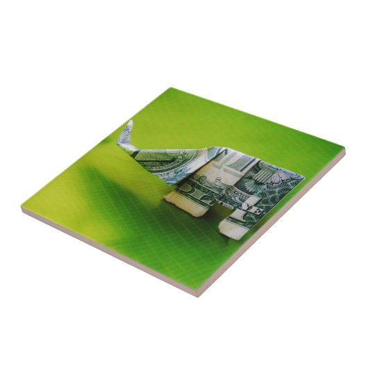 Dollar-Bill Origami Elephant auf grünem Hintergrun Fliese (Seite)