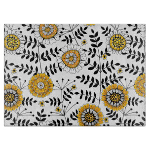 Doodle-Blume und -Blätter in Gelb und Schwarz Schneidebrett