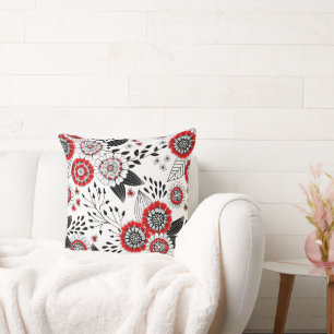 Doodle-Blume und -Blätter in Rot und Schwarz Kissen