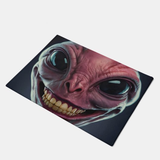 Doormat mit einem Alien-Motiv. Fußmatte (Schrägansicht)
