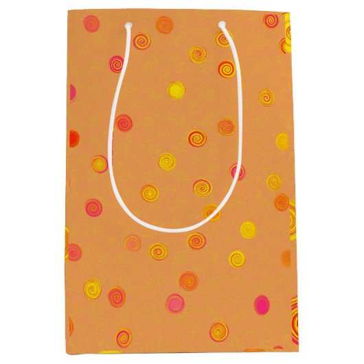 Drehende Spiralen mit Punkten Orange Geschenktüte (Vorderseite)