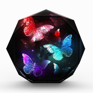 Drei glühende Schmetterlinge im Hintergrund Fotoblock