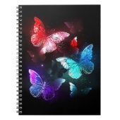 Drei glühende Schmetterlinge im Hintergrund Notizblock (Vorderseite)