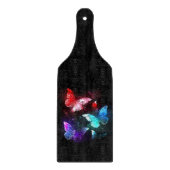 Drei glühende Schmetterlinge im Hintergrund Schneidebrett (Vorderseite)