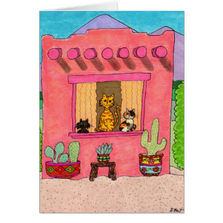 Drei Katzen in einem rosa Adobe House