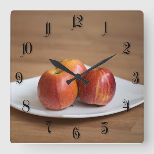 Drei reife Äpfel Quadratische Wanduhr (Vorderseite)
