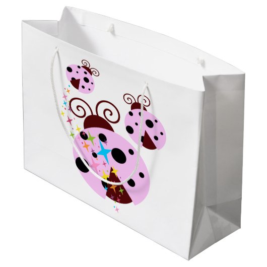 Drei rosa und schwarzer Marienkäfer mit Sternen Große Geschenktüte (Rückseite Schrägansicht)