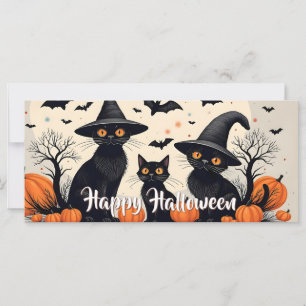 Drei schwarze Katzen zu Halloween