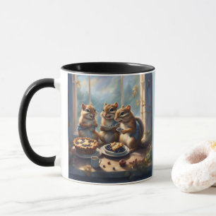 Drei Streifenhörnchen essen Blaubeerkuchen auf der Tasse