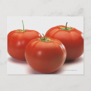 Drei Tomaten auf dem Schalter, nah Postkarte